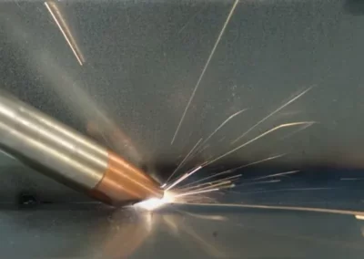 Precision mechanical testing in action, showcasing material stress analysis with sparks flying as metal is tested under pressure